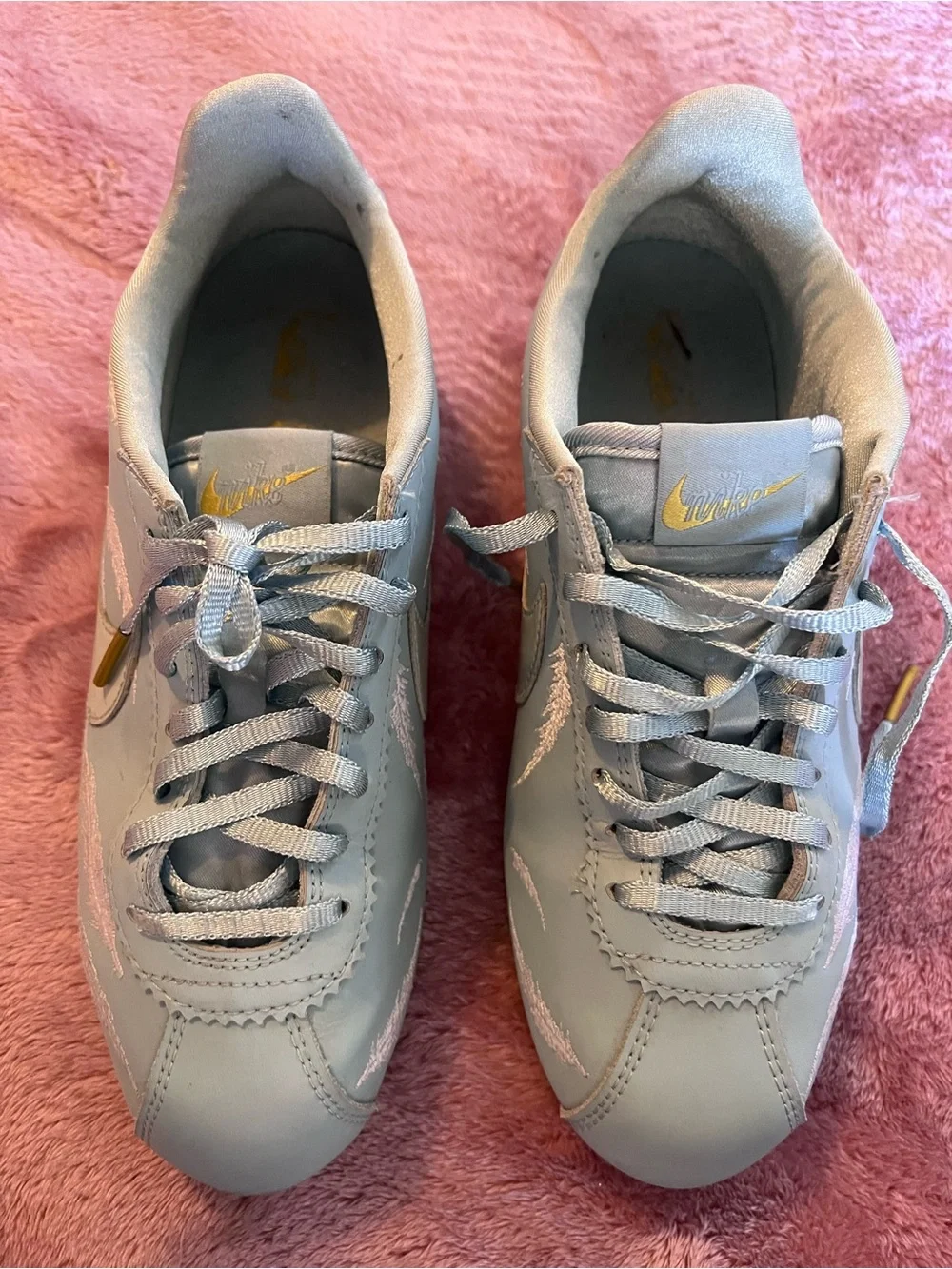 Nike Light Blue Cortez Sneakers with Pink Feather Stitching